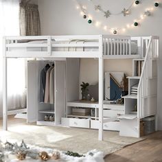 a white bunk bed with stairs and drawers underneath it in a room decorated for christmas