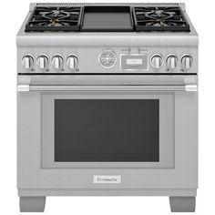 a silver stove with four burners and two oven doors on each side, in front of a white background