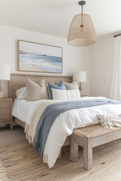 a bedroom with a large bed and white linens