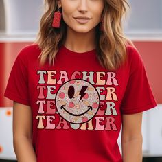 Teacher Tshirt Retro Gift for Teacher Appreciation Week Shirt for Her Gift Shirt Retro Graphic Tee Shirt for Teacher Back to School Shirt Get ready for Teacher Appreciation Week or Back to School with our retro Teacher graphic tee. Dress for the school year in style!  🍍𝗣𝗥𝗢𝗗𝗨𝗖𝗧 𝗜𝗡𝗙𝗢𝗥𝗠𝗔𝗧𝗜𝗢𝗡: * Exact Measurement Info in Listing Photos * Bella Canvas Unisex Short Sleeve Tee * Runs True to Size * Super Soft * 6 Sizes: S-3XL * Available in Canvas Red, Forest Green, Mustard, Soft Pin Pre-shrunk Graphic Tee For Teacher Appreciation, Funny Red Crew Neck Top, Funny Red Tops With Letter Print, Red Funny Tops With Letter Print, Funny Red Pre-shrunk Tops, Red Slogan Short Sleeve Shirt, Red Pre-shrunk Tops, Fun Graphic Print T-shirt For Teacher Appreciation, Fun Teacher Appreciation T-shirt With Graphic Print