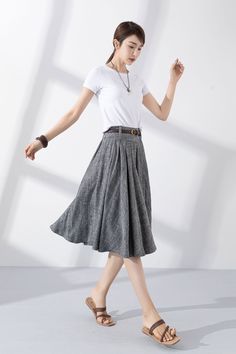 "Add some vintage-inspired charm to your wardrobe with our gray linen pleated swing circle skirt. Made from high-quality materials, it's both soft and durable, and perfect for keeping you looking and feeling your best. The unique pleated design adds a touch of classic elegance, while the swing circle cut gives the skirt a playful, feminine flair. Whether you're dressing up for a special occasion or keeping it casual for a day out with friends, this skirt is the perfect choice. Order now and add Gray Midi Skirt For Summer, Summer Gray Pleated Skirt, Gray Long Pleated Skirt, Gray Knee-length Skirt For Spring, Summer Gray Lined Skirt, Long Gray Pleated Skirt, Gray Pleated Long Skirt, Relaxed Gray Skirt For Spring, Gray Relaxed Skirt For Spring