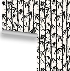 a wallpaper with black and white bamboo trees on it