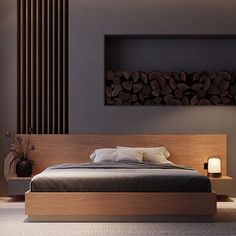 a large bed sitting in a bedroom next to a wall with logs on the headboard