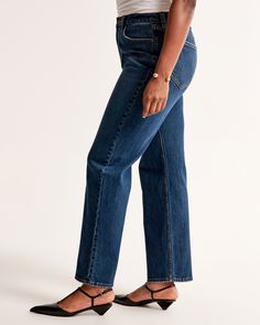 Elevate your wardrobe with the timeless elegance of Abercrombie & Fitch's Women's High Rise Vintage Straight Jeans. These jeans are a perfect blend of classic style and modern comfort, tailored to enhance your silhouette.

- Size: 31 LONG
- Color: Dark
- Material: Pocket Bag - Polyester, Cotton Blend
- Gender: Female
- Fit: High rise (10.5”), relaxed at the waist and hips, straight-leg shape
- Features: Clean hem, vintage stretch fabric for comfort with an authentic vintage look

Ideal for any o Vintage Straight Jeans, Dark Material, Women's Bottoms, Pocket Bag, Dark Wash Denim, New Classic, Evening Attire, Classic Vintage, Polished Look