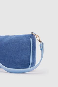 Hey there! Introducing the trendy and fabulous Kate Denim Buckled Denim Baguette Bag from Lunarity Garage! This baguette bag is the ultimate style statement that combines fashion and functionality. Crafted with attention to detail, the Kate Denim Buckled Denim Baguette Bag features a chic denim material that's both stylish and durable. Its denim-on-denim design adds a touch of flair and makes it a must-have accessory for any denim lover. The unique buckle detail adds a hint of sophistication and Trendy Blue Rectangular Baguette Bag, Rectangular Denim Blue Shoulder Bag For Spring, Denim Blue Rectangular Shoulder Bag For Spring, Trendy Blue Shoulder Baguette Bag, Trendy Blue Baguette Shoulder Bag, Trendy Blue Baguette Bag For Everyday, Trendy Baguette Bag, Chic Denim Blue Rectangular Shoulder Bag, Casual Blue Baguette Bag For Daily Use