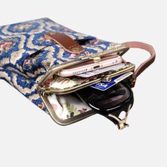 With a nod to the Victorian era, MCW’s freshly combines the classic and elegant design of the traditional carpet bag with a textural and tactile twist.The main body of the functional phone case is made with rich chenille carpet, cotton floral canvas, and brass clasp with double kiss lock. With the width 4.15" and height 8.60" it can easily hold phones of any sizes (max phone width to 4"), with the leather wrist strap that comes with the bag. There are two mini rings at both sides of the clasp an Vintage Phone Bag With Removable Pouch For Travel, Vintage Travel Phone Bag With Removable Pouch, Vintage Phone Bag With Cell Phone Pocket For Travel, Vintage Travel Phone Bag With Cell Phone Pocket, Vintage Phone Bag For Travel, Victorian Carpet, Traditional Carpet, Style Carpet, Carpet Bag