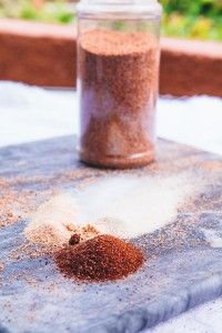 a jar filled with spices sitting on top of a table