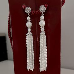 These Are Elegant Faux Pearl Earrings Beautifully Embellished With Rhinestones. They Measure 4” Long And Have Some Weight To Them. They Can Be Worn With Formal Attire Or Can Elevate A Casual Outfit. They Are Brand New. Elegant Pearl Drop Tassel Earrings For Party, Elegant Silver Tassel Earrings With Dangling Beads, Elegant Tassel Earrings With Dangling Beads For Wedding, Wedding Tassel Drop Earrings With Rhinestones, Glamorous Rhinestone Tassel Earrings For Wedding, Elegant Wedding Tassel Earrings With Dangling Beads, Silver Tassel Earrings With Rhinestones For Wedding, Silver Rhinestone Tassel Earrings For Wedding, Elegant Crystal Tassel Earrings With Rhinestones