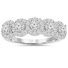 a white gold ring with three stones on the side and two rows of diamonds in the middle