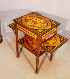 two wooden tables sitting on top of each other