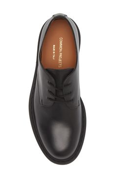 A plain toe enhances the sleek look of an ultrasmooth leather derby crafted in Italy and branded by a foiled logo at the heel. Lace-up style Leather upper and lining/rubber sole Made in Italy Designer Shoes Classic Leather Lace-up Shoes With Rubber Heel Cap, Modern Oxfords With Leather Lining And Plain Toe, Sleek Oxfords With Leather Sole For Derby, Sleek Oxfords With Rubber Sole And Plain Toe, Sleek Leather Shoes For Derby, Workwear Derby Shoes With Branded Insole And Almond Toe, Classic Leather Derby Shoes With Rubber Heel Cap, Classic Calf Leather Lace-up Shoes For Derby, Classic Leather Derby With Rubber Heel Cap