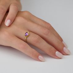 This gorgeous ring features a lavender-pink, rose cut sapphire wrapped in warm 22k gold, and accented with a single sparkling diamond. This ring is lovely on its own, and stacks beautifully with others in the collection. The setting measures approximately 6.5mm x 7.5mm. 18k gold 1.5mm, hammered band. Matte finish. Gold Amethyst Rings With Rose Cut Diamonds, Anniversary Rings With Rose Cut Pink Sapphire, Gold Pink Sapphire Ring For Wedding, Anniversary Pink Sapphire Ring With Rose Cut Diamonds, Wedding Pink Sapphire Ring In Yellow Gold, Wedding Gold Pink Sapphire Ring, Wedding Yellow Gold Pink Sapphire Ring, Gift Pink Sapphire Ring With Rose Cut Diamonds, Pink Sapphire Ring With Rose Cut Diamonds As Gift