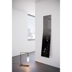 a black and white sculpture sitting in the middle of a room