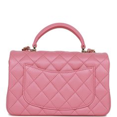 This Mini Rectangular flap bag is in dark pink lambskin with light gold tone hardware and has a front flap with signature CC turnlock closure, rear half moon pocket, top handle and single interwoven dark pink leather and light gold tone chain link shoulder/crossbody strap. The interior is lined in dark pink leather and features a zipper pocket with Chanel pull and an open pocket below. Collection: 22A Origin: Italy Condition: Pristine; new or never Accompanied by: Chanel box, Chanel dustbag, felt, carebook and ribbon Measurements: 8.5" width x 6" height x 3" depth; 1.77" top handle, 22.5" strap drop Chanel Mini Rectangular, Chanel Box, Chanel Mini, Pocket Top, Flap Bag, Pink Leather, Lambskin Leather, Handbag Backpack, Half Moon