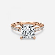 a rose gold ring with a princess cut diamond