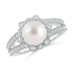 At the center of this charming pearl flower ring is a lustrous South Sea pearl. The prong set diamonds surrounding the cultured pearl create a brilliant floral halo while the pavé set diamonds on the split shank lend added glamour to the ring. Intricate milgrain detailing along the edges make this a truly exquisite pearl split shank ring in 14K white gold. Platinum Halo Ring, Pearl Halo Ring, Pearl Flower Ring, Rose Gold Halo Ring, Birthstone Engagement Rings, Girls Ring, Cultured Pearl Ring, Floral Halo, Split Shank Ring