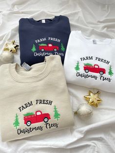 three farm fresh christmas tees and ornaments on a white sheet with the words farm fresh written across them