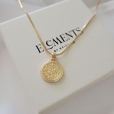 Round gold coin medallion necklace. Wear it on it's own or layer it.  Pendant details:  * Finish: non tarnish 14K gold filled  * Measurements: 0.9'H 0.7'W Chain: non tarnish gold filled Comes in our gift ready packaging: vegan leather pouch for safe jewelry storing and branded box  GOLD FILLED Tarnish Resistant. Hypoallergenic. Long Lasting. Gold filled is affordable alternative to solid gold. Hypoallergenic - sensitive skin friendly. With proper care it will last for years. What is Gold Filled? Gold Tarnish-resistant 14k Gold-filled Coin Necklace, Tarnish Resistant 14k Gold Filled Coin Necklace, 14k Gold Coin Pendant Necklace For Everyday, Everyday 14k Gold Coin Necklace, Gold Coin Necklace For Everyday, Gold Dainty Chain Necklace With Coin Pendant, 14k Gold Filled Charm Necklace With Coin Pendant, Everyday 14k Gold-filled Coin Necklace, Everyday 14k Gold Filled Coin Necklace