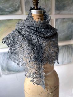 a close up of a mannequin wearing a scarf