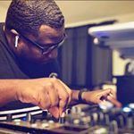 a man that is sitting at a dj's desk