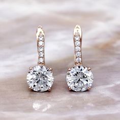 4.00 TCW Moissanite Dangle Drop Earrings, Round Cut 8 MM Synthetic Moissanite Drop Earrings, New Sterling Silver Earrings With Latch Back Description:: Metal: 925 Sterling Silver Stone: Synthetic Moissanite Stone Shape: Round Total Carat Wt.: 4.20 CT. Main Stone Wt.: 2.00 CT x 2 ( 8 MM) Length: 13 MM Width: 8 MM Synthetic Moissanite: D Color | VVS1 Clarity Closure: Latch Back * Contact Us for Custom Orders. * Customization also available. * All Ring Sizes available please choose from drop down. Moissanite Earrings, Diamond Drops, Gold Earrings Dangle, Silver Drop Earrings, Girls Earrings, Jewelry Earrings Hoops, Moissanite Diamonds, Round Earrings, Diamond Studs