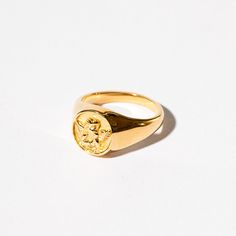 The Seraphina Ring is perfect for those who want a little bit of aristocrat in their look. A ring modelled on the iconic signet rings of old. This masculine style is made sweet with an innocent angel sitting atop it's centre. Pair it with something special or wear it with casual attire for a chic gold injection. Wear it on your pinky for extra edge or give it to a man you love. It is a perfect match with our Seraphina Pendant too! Angel Sitting, Masculine Style, Gold Angel, Signet Rings, Pinky Ring, Family Crest, Casual Attire, Wide Bands, Signet Ring