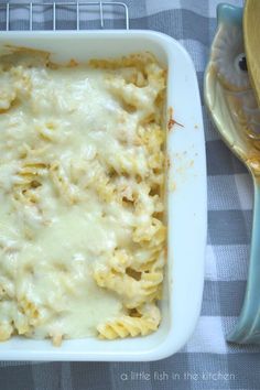 a casserole dish filled with chicken and cheese