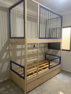 a bunk bed sitting in the corner of a room