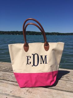 "Monogrammed Tote Bags by Deshler Designs This tote bag makes the perfect gift for any occasion. Available in 3 fun colors and big enough to fit all your necessities. Monogram included...you could do a 3-letter monogram, name, or single large initial. Match the bag color, or choose another color of your choice! Material: Canvas, Pleather Accents Dimensions: 18\"W x 12.5\"H x 9.5\"D One open compartment with one interior pocket Handle Drop: 6\" **lime green & hot pink have sold out Please inc Personalized Rectangular Canvas Bags, Personalized Canvas Tote Bag For Everyday Use, Personalized Rectangular Canvas Shopping Bag, Customizable Pink Bag For Shopping, Customizable Pink Shopping Bag, Everyday Personalized Tote Bag, Personalized Everyday Tote Bag, Personalized Tote Bags For Daily Use, Personalized Monogram Tote Bag