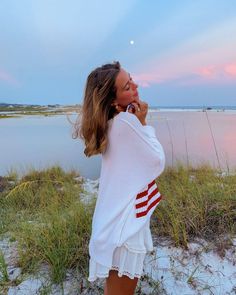 Show your patriotic pride in the Land of Free White Oversized Flag Sweater! White knit fabric forms a boat neck sweater that can be worn or slouchy off-the-shoulder. Preppy flag sweater with oversized bodice with drop shoulders and long sleeves. Features alternate crochet knit with American flag design. Style over your favorite jeans for an effortlessly cute and casual look! DETAILS & FIT 100% Cotton. Machine Wash Cold. Imported. ORDERS, SHIPPING & RETURNS Orders, Shipping, & Returns . Preppy Pullover, Flag Sweater, Sweater Boho, Boat Neck Sweater, American Flag Sweater, White Flag, Boatneck Sweater, Sweater White, Pink Boho