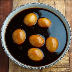 an overhead view of some kind of food in a bowl on a wooden table top