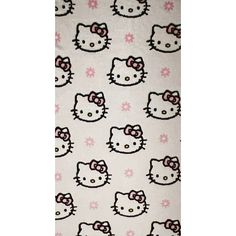 a hello kitty blanket with pink bows on it