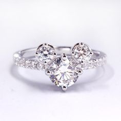 a diamond ring with three stones on it