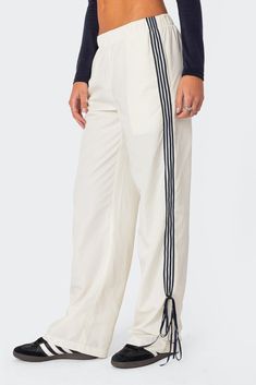 PRODUCT INFO Track pants Side stripe detailing Ribbon tie ankle detail Elastic waist Polyester Model wears size S Model height is 5'8 Item care: Wash with similar color Y2k Sweatpants, Track Pants Women, Bow Ribbon, Ribbon Tie, Side Stripe, S Models, Stripes Design, Christmas List, Pacsun