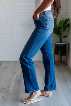 Effortlessly step up your denim game with our Campbell High Rise Seam Detail Straight Jeans from Judy Blue. Featuring a flattering high rise fit and a classic dark wash, these jeans also include center front and back seam details for an added touch of style. The straight leg silhouette is versatile and can be worn with an optional cuffed hem for a chic look. Plus, our non-distressed denim ensures a polished appearance. Upgrade your wardrobe with these timeless jeans that offer both fashion and c Mid-rise Medium Wash Flare Jeans, High Rise Denim Jeans With Frayed Hem, Dark Wash High Rise Jeans With Frayed Hem, Everyday Dark Wash Flare Jeans With Frayed Hem, Medium Wash Stretch Flare Jeans With Cropped Leg, Stretch Medium Wash Cropped Leg Flare Jeans, Everyday Dark Wash Mid-rise Flare Jeans, Non-stretch Five Pockets Dark Wash Cropped Jeans, Trendy Dark Wash Cropped Leg Flare Jeans