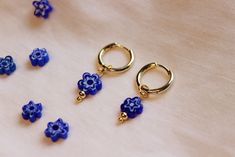 Millefiori Flower Gold Hoop Earrings in blue Glass millefiori flower beads Bead dimensions: 8x8x3.2mm Made with 18k gold plated hoops / hardware Also available in Silver / 304 Stainless Steel which is durable, resistant to rust and discolouration! Use code FEBRUARY20 for 20% off when you spend over £20!! Materials and Care: This item is 18K gold plated. Regularly polish and buff the metal using a soft (lint-free) cloth. Avoid contact with water / liquids. Packaging: All products come with freebies and are packed by hand, so they make a great gifting experience! Postage: All orders are dispatched in 1-2 working days. ------------------------------------------------------------------- ♥ Join our newsletter: https://bit.ly/JoinTheWonderLounge ♥ Instagram: thewonderlounge Handmade Blue Huggie Earrings, Handmade Blue Huggie Hoop Earrings, Blue Huggie Earrings As Gift, Blue Dangle Huggie Earrings As Gift, Handmade Blue Huggie Jewelry, Blue Flower Shaped Hoop Earrings, Blue Flower-shaped Hoop Earrings, Blue Flower Hoop Earrings As Gift, Blue Flower Hoop Earrings Gift