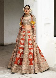 Bridal Lehenga Choli with Dupatta Indian Bridal Wear is a breathtaking masterpiece that will give you a head-turning traditional look at the wedding. Intricate designs and fine details of silverwork make this Lehenga Dress an epitome of beauty and grace. Bridal Choli The choli has a magnificent rust shade and is gracefully emblazoned with beaming adda work. Hand-crafted details of sequins, tilla, silverwork, and mukaish enhance the glamour of the choli, making it a perfect choice to pair with th Traditional Wedding Dress For Ceremonies, Traditional Fitted Wedding Dress With Drape, Traditional Fitted Wedding Dress With Pallu, Traditional Floor-length Wedding Dress, Traditional Festive Wedding Dress, Traditional Fitted Wedding Dress For Festive Occasion, Traditional Wedding Dress With Pallu, Traditional Wedding Dress With Pallu For Festive Occasion, Traditional Wedding Dress With Zari Work For Ceremonies