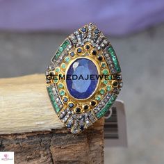 Tanzanite Gemstone Ring, Pave Diamond Ring, 925 Silver Ring, Gold Plated Jewelry, Gemstone Ring Jewelry, Designer Ring, Valentine Day Gift Gross Weight: 11.64 gram Gemstone Weight: 9.22 cts Diamond Weight: 1.10 cts Ring Size: 36X24 MM NOTE:- All The Products Are Designed And Manufactured In My Workshop By Me & My Team. Shown Products Are Purely Handmade. Custom Orders Are Open Handly Accepted. We Are Perfect Choice For Any Custom Jewelry Manufacturing. For Bulk Orders Please Message me. Visi Jewelry Manufacturing, Valentine Day Gift, Pave Diamond Ring, Tanzanite Gemstone, 925 Silver Ring, Blue Gems, Diamond Rings Bands, Jewelry Gemstone, Eternity Band Diamond