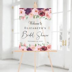 an easel with a sign that says welcome to elizabeth's bridal shower