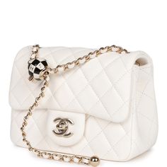 This Pearl Crush Mini Square flap bag is of white lambskin with light gold tone hardware and has a front flap with signature CC turnlock closure, rear half moon pocket, single interwoven white leather and light gold tone chain link shoulder/crossbody strap with adjustable "pearl" ball. The interior is lined in gold leather and features a zipper pocket with Chanel pull and an open pocket below. Collection: 23C Origin: Italy Condition: Pristine; new or never Accompanied by: Chanel box, Chanel dust Chanel Pearl Crush, Chanel Pearl, Chanel Box, Chanel Pearls, Chanel Model, Leather Thread, Prada Handbags, Outfit Casual, Gold Leather