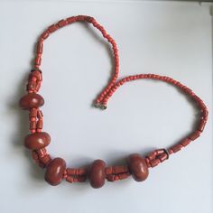 A resin beads necklace inspired by the traditional Amazigh tribal jewellery. A warm reddish maroon colour makes it a fantastically elegant Valentines' gift for your loved ones. All gifts come with complimentary wrapping and card. Fair Trade Orange Jewelry Gift, Traditional Orange Beads For Gifts, Orange Fair Trade Jewelry Gift, Amber Necklace With Wooden Beads For Gifts, Red Fair Trade Jewelry As A Gift, Traditional Wooden Beads For Gifts, Traditional Wooden Beads As Gift, Red Fair Trade Necklace As Gift, Orange Jewelry With Wooden Beads For Gifts