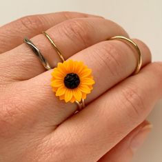 "Adjustable Sunflower Ring Sunflower Jewelry -I make this ring using an silver finish adjustable ring base and an orange resin sunflower cabochon -sunflower measures 5/8\" across -adjustable -nickel and lead free -Gift Boxed More of my Sunflower Jewelry Here: https://www.etsy.com/shop/lydiasvintage/items?search_query=sunflower More of my Jewelry: lydiasvintage.etsy.com" Fall Jewelry Inspiration, Resin Sunflower, Sunflower Accessories, Gold Pendants For Men, My Sunflower, Sunflower Bracelet, Orange Resin, Quilled Jewellery, Sunflower Ring