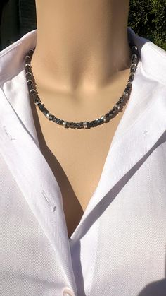 Hematite Choker Necklace with Stainless Steel  Accents Hematite Necklace : 19 inches long This elegant necklace is a great gift for yourself and your loved ones. It is made from Hematite. All metal ornaments are stainless steel, and won't get darker in time unles it gets in touch with chemicals- such as perfumes, shampoo etc.- and sea water !  FREE SHIPPING ✈️ ✈️  4-10 days of delivery time  * Returns are allowed 14 days after the delivery, however, the cost of delivery lies on the buyer.  Hematite is believed to support kidney health by cleansing the blood and improving circulation, potentially lowering blood pressure and alleviating symptoms of leg cramps and anxiety. Hematite Necklaces With Natural Stones For Gift, Hematite Jewelry With Faceted Beads For Gift, Hematite Natural Stone Necklaces For Gifts, Hematite Natural Stones Necklace For Gift, Adjustable Hematite Necklace For Gift, Silver Hematite Necklace Gift, Elegant Hematite Necklace For Gift, Metal Ornaments, Natural Gemstone Necklace