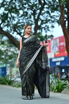 Exclusive hand-woven Sambalpuri silk saree with tribals. Finest pure handwoven sambalpuri ikat silk saree with traditional motifs woven by the master weavers of Sambalpur, Odisha. It has lovely patterns and is world-famous for its stunning colours, texture and designs. Occasion: Party Wear Fabric: Sambalpuri Primary Color: Black  Secondary Color: Neon Green Material: Mulberry Silk/ Sambalpuri Silk Pattern: Motif Border Type: Ikkat Border Size: Medium Blouse Piece: Included Care: Dry Clean Disclaimer : This is a genuine handwoven piece, unevenness in the selvedge and weave could be expected and colours may fade or bleed due to the traditional dyeing method employed. Transitional Tussar Silk Saree With Ikat Print, Transitional Season Tussar Silk Saree With Ikat Print, Black Tussar Silk Saree With Weaving Work, Festival Traditional Wear With Ikat Print In Cotton Silk, Traditional Cotton Silk Dupatta With Ikat Print, Traditional Ikat Print Cotton Silk Dupatta, Black Bohemian Handloom Traditional Wear, Bohemian Black Handloom Traditional Wear, Festival Cotton Silk Saree With Ikat Print