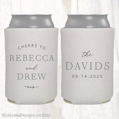 two white can coolers with the names of their wedding guests and date printed on them