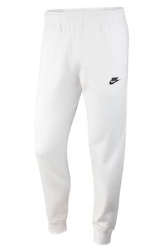 An embroidered Swoosh marks the pocket of these sweatpants made for comfort from fleece with a sporty fit that slims at the ankle. 28 1/2" inseam; 10" leg opening; 12 1/2" front rise; 16 1/2" back rise (size Medium) Elastic/drawstring waist Side-seam pockets; back welt pocket Cotton/polyester Machine wash, tumble dry Imported Superstar Outfit, Nike Sportswear Mens, White Sweatpants, Style Sweatpants, Stylish Hoodies, Nike Sweatpants, Mens Club, Hot Sneakers, Fashion Joggers