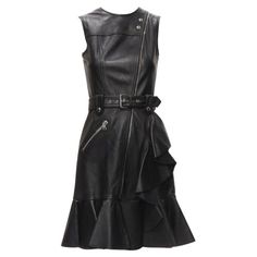 ALEXANDER MCQUEEN 2022 black leather biker belted ruffle trim dress IT38 XS Reference: AAWC/A00036 Brand: Alexander McQueen Designer: Sarah Burton Material: Leather Color: Black, Silver Pattern: Solid Closure: Zip Lining: Fully Lined Extra Details: Silver-tone hardware. Buckle belt at waist. Ruffle trim . Flutter skirt. Made in: Italy CONDITION: Condition: Excellent, this item was pre-owned and is in excellent condition. SIZING Designer size: IT38 Size reference: US0 / UK6 / IT38 / FR34 / XXS-XS Alexander Mcqueen Dresses, Sarah Burton, Ruffle Trim Dress, Trim Dress, Buckle Belt, Ruffle Trim, Alexander Mcqueen, Evening Dresses, Alexander