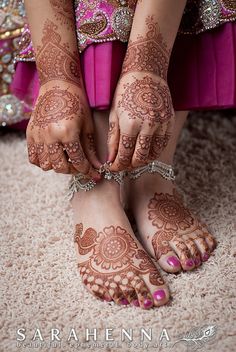 a woman with henna on her feet