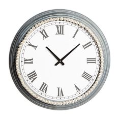 a round clock with roman numerals on the face is shown against a white background