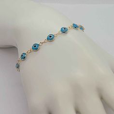 Experience The Beauty Of This Brand New Brazilian 18k Gold Filled Baby Blue Evil Eye Bracelet! Surround Yourself With Protection As You Wear This Luxurious Piece Crafted With 18k Gold-Filled And A Beautiful Baby Blue Evil Eye. With A Length Of 7 Inches And An Included Jewelry Bag, This Bracelet Will Stay Looking Like New For Years, Never Tarnishing With Proper Care. Make A Statement And Shine With This Exquisite Bracelet Today! Elegant Adjustable Blue Gold Bracelet, Elegant Blue Adjustable Gold Bracelet, Blue Hypoallergenic Evil Eye Bracelet As Gift, Hypoallergenic Gold Plated Blue Jewelry, Hypoallergenic Blue Evil Eye Bracelet Gift, Blue Gold Plated Jewelry For Party, Hypoallergenic Blue Gold-plated Jewelry, Blue Gold-plated Jewelry For Party, Blue Round Gold Bracelet For Gift